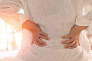 Back pain in woman concept. Pain Management Physician