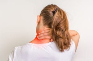 Woman with muscle injury having pain in her neck due to Cervical Disc Herniation