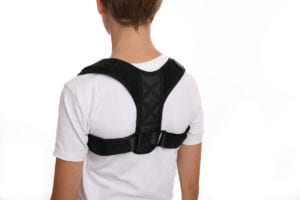 Child/ school boy with posture corrector.