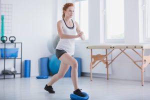 Female athlete doing physical therapy exercises