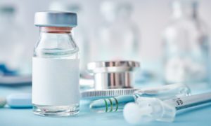 Vile with steroids and a needle