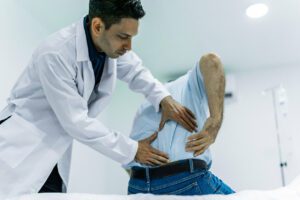 Doctor examining a patient chronic spinal pain