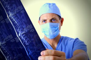 Spine surgeon reading and MRI of a spine