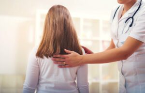 Therapist giving therapy Treatment for Spinal Stenosis