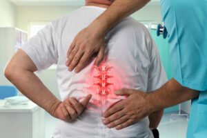 Spine doctor examining the spiny injury pain of a male patient