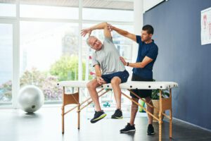 Patient at physical therapy appointment for Lumbar Stenosis Relief.