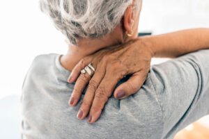 older woman with neck pain