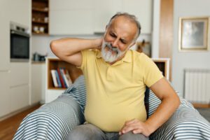 older man with pinched nerve in the neck