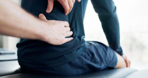 A patient undergoing therapist for back pain and spine.