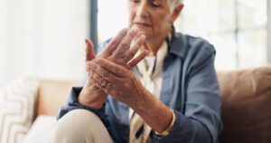Elderly woman with manifestations of arthritis.